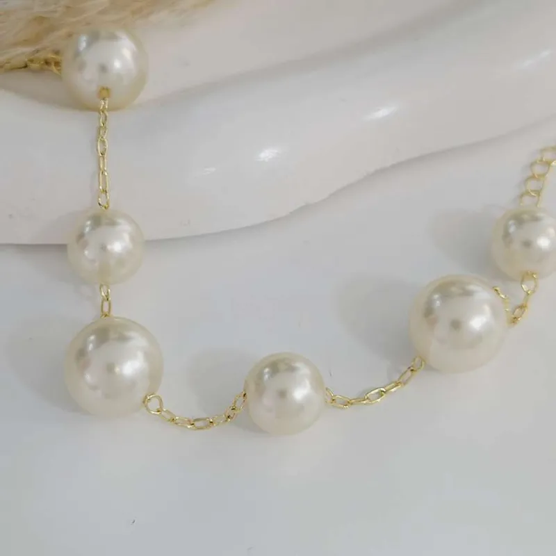 Pulseira de pérolas grandes, folheado a ouro 18k, foto da loja UseLírios